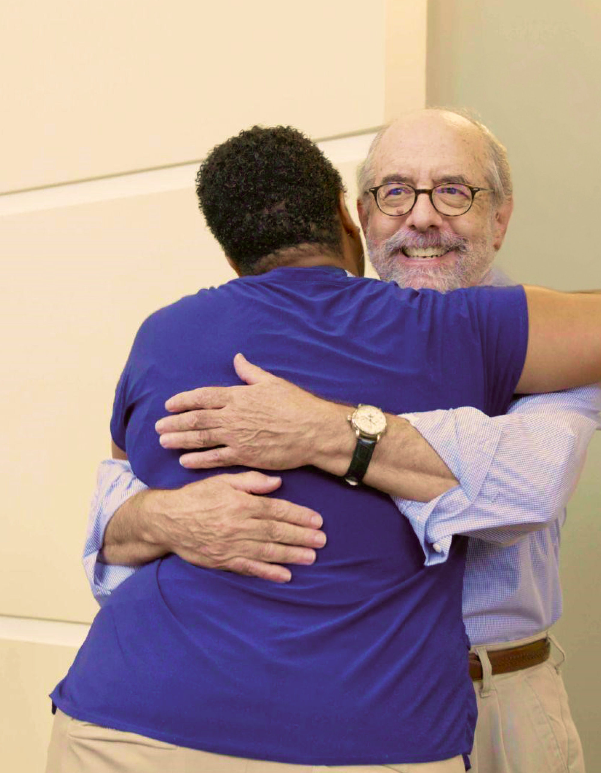 radiation therapist hugging a patient