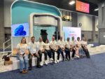 Picture of Leo Cancer Care team on their stage at ASTRO