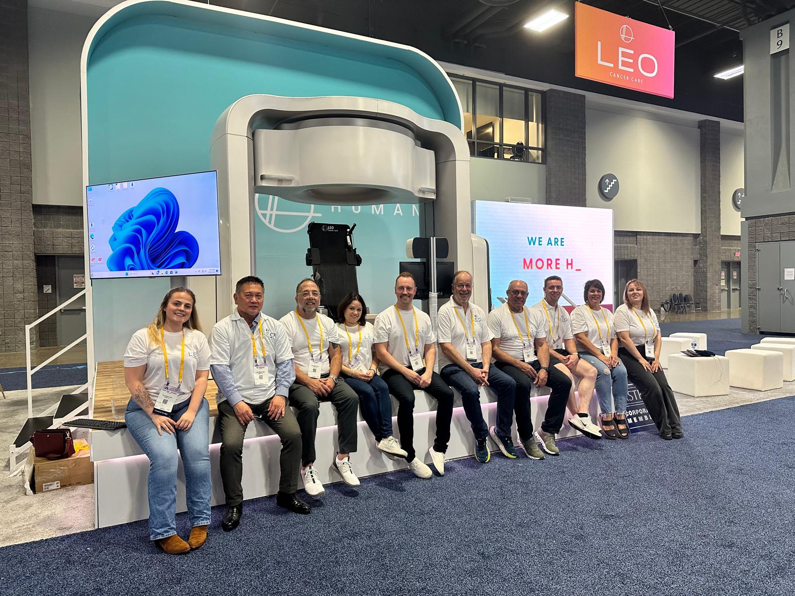 Picture of Leo Cancer Care team on their stage at ASTRO